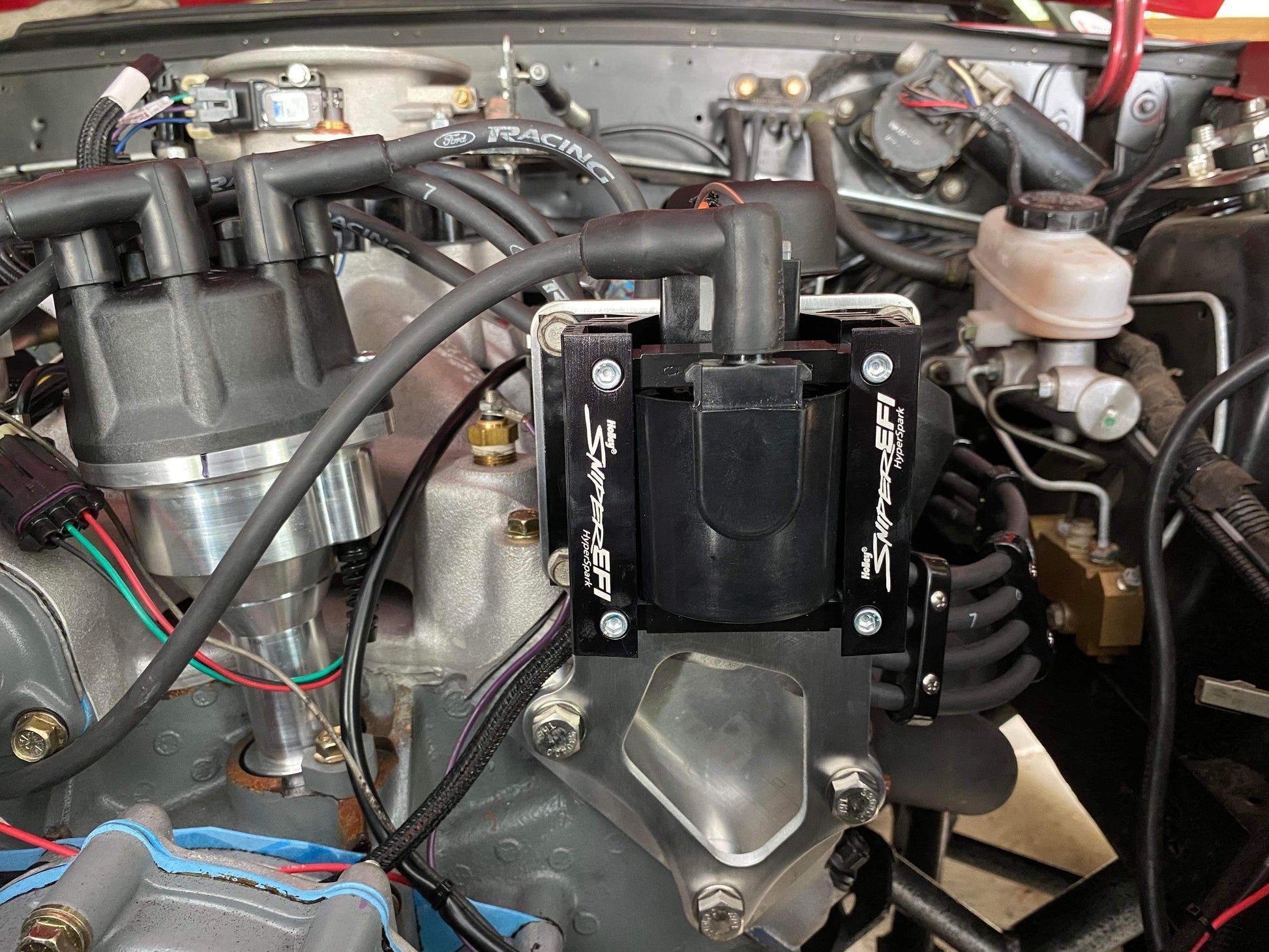 Ignition coil bracket for car engine bay