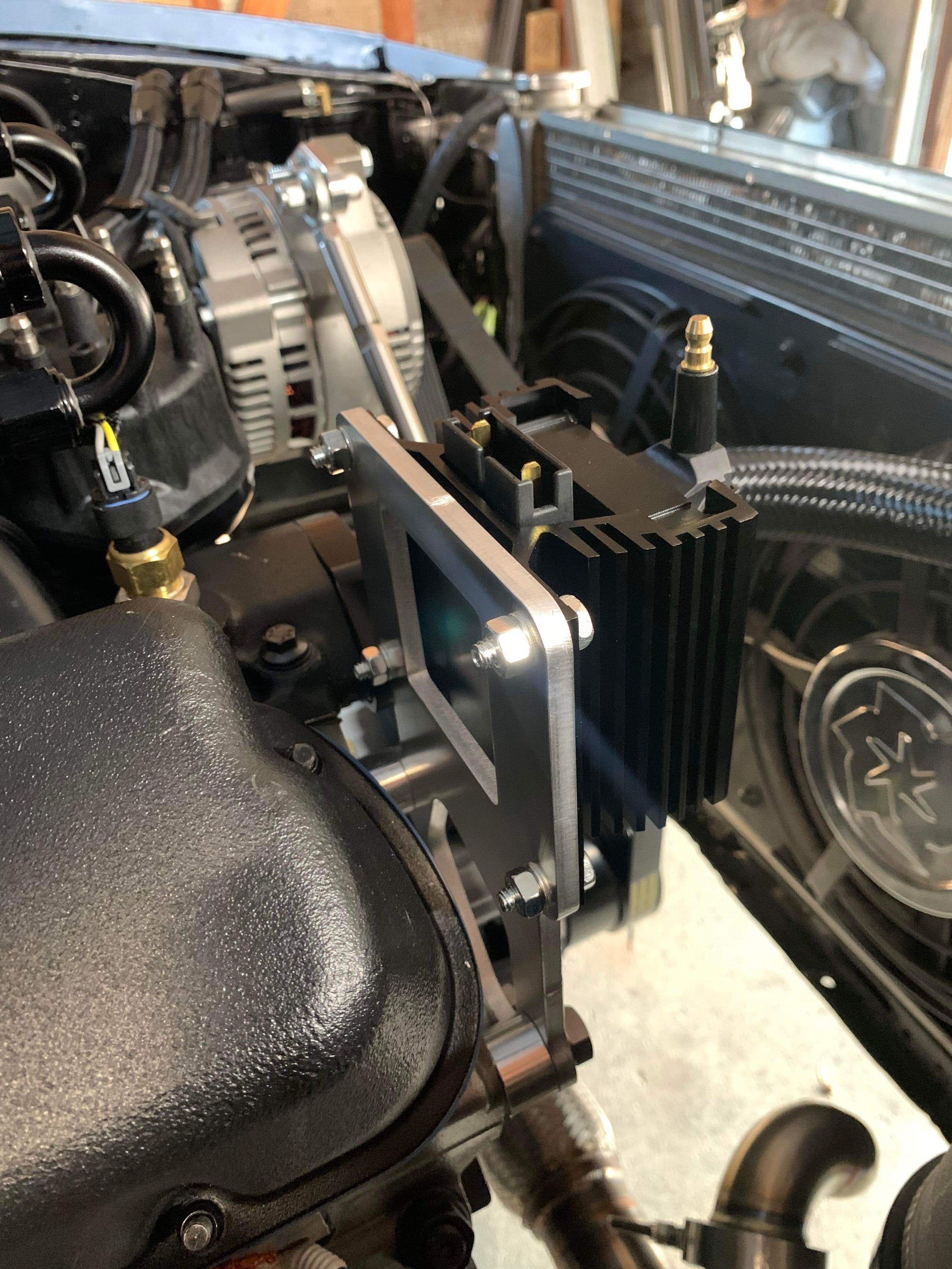 Close-up view of metal ignition coil bracket